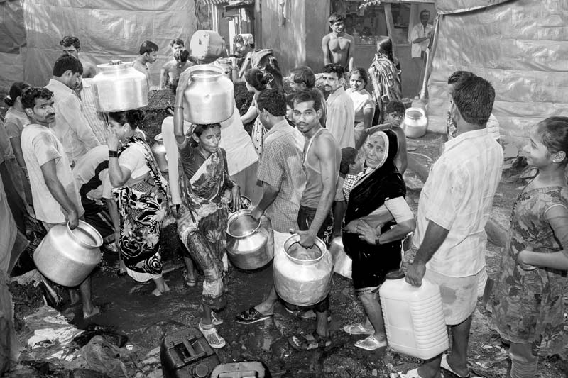 Human Right to Water in India - Struggling to procure a share in the scanty water supply in an urban slum in Mumbai, Maharashtra